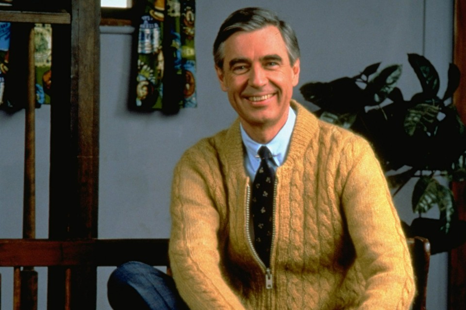 Fred Rogers poses on the Pittsburgh set of his television show Mister Rogers' Neighborhood, in this 1996 publicity photo. Rogers' new book, Dear Mister Rogers: Does It Ever Rain in Your Neighborhood?, is a treasury of letters from young viewers, and Rogers' responses. (AP Photo/pool)